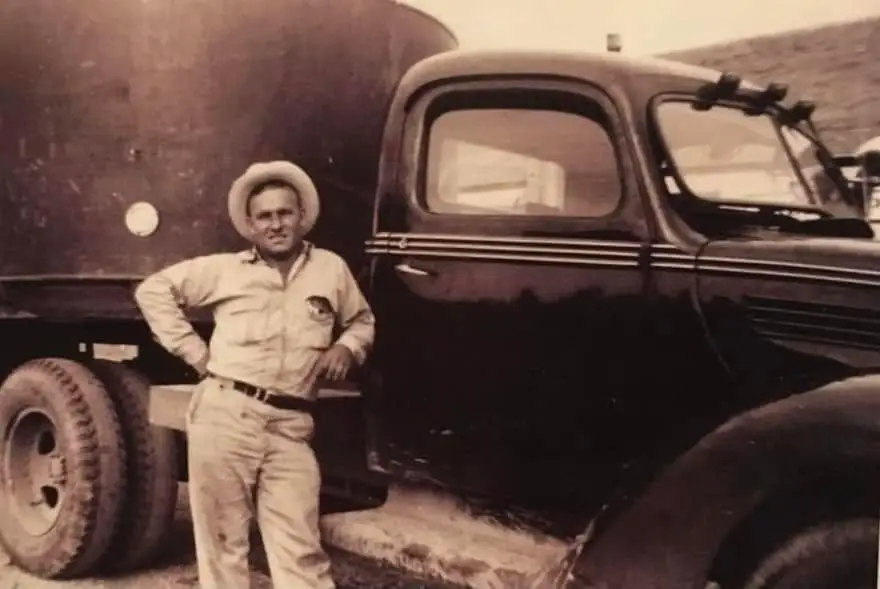 J.D. Jimeson standing beside his freight truck